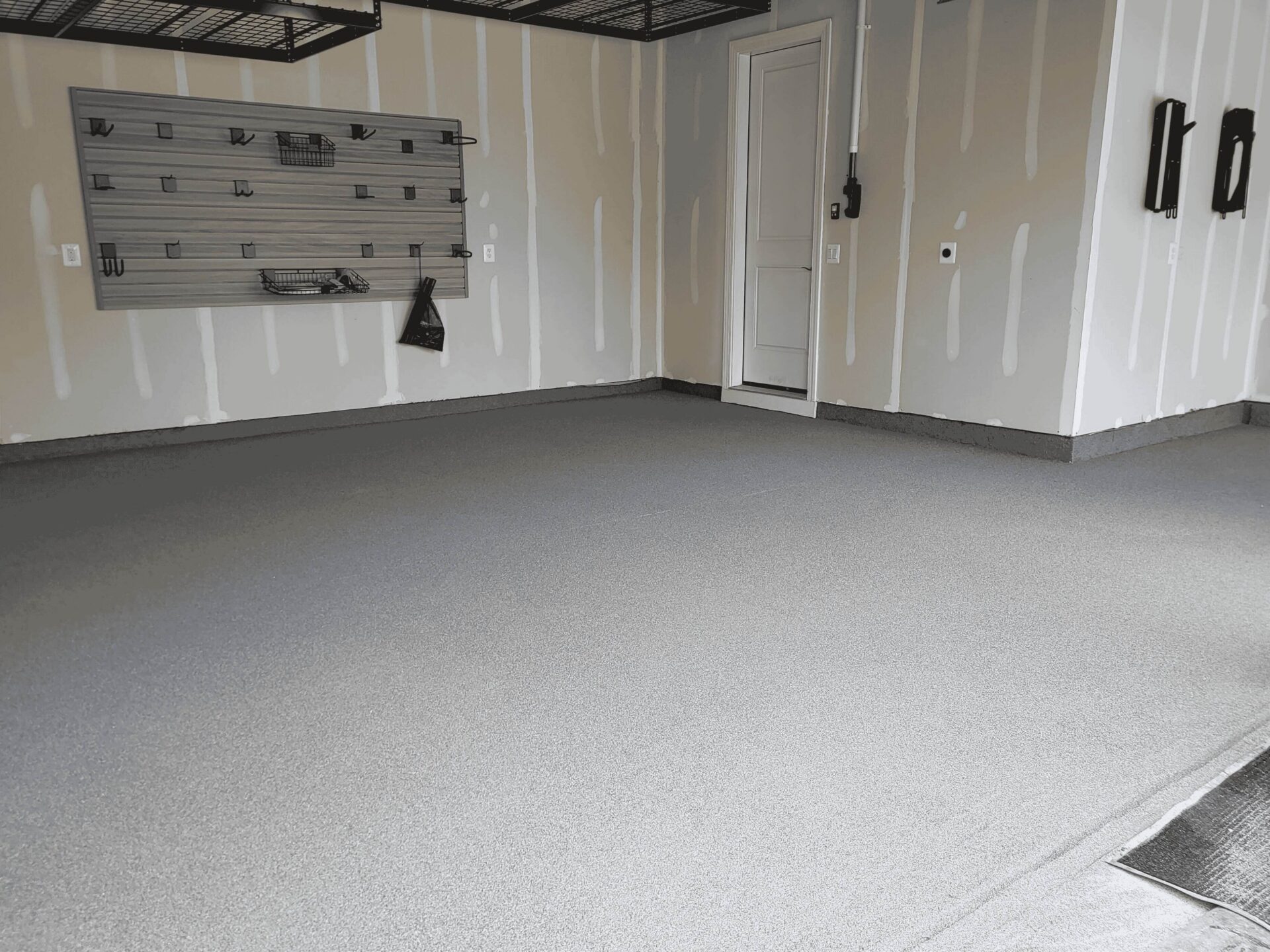 Garage with flooring and storage