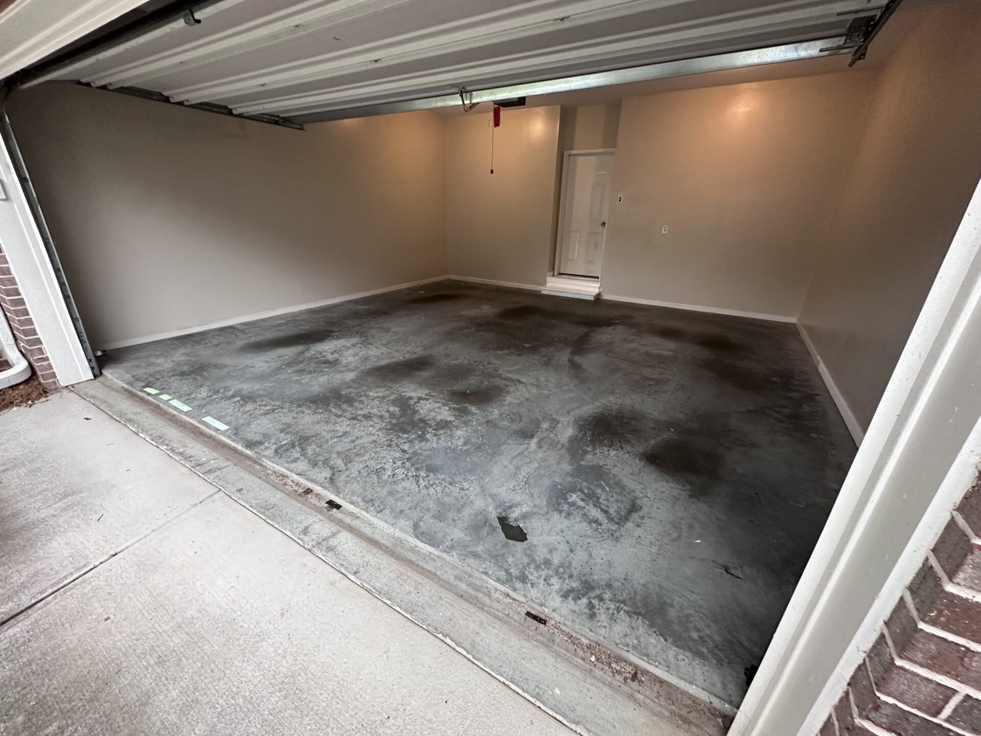Dirty, stained garage floor coating