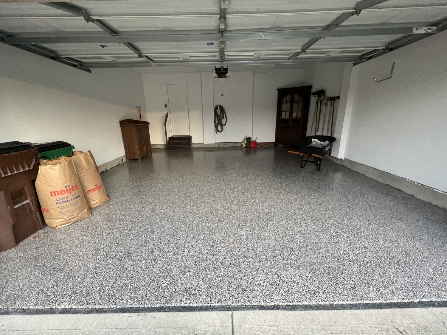 Garage floor coating with some garage items on it