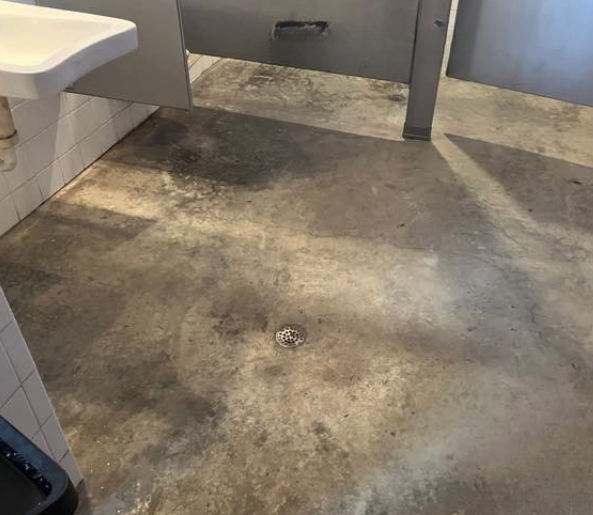 Uncoated concrete in commercial restroom