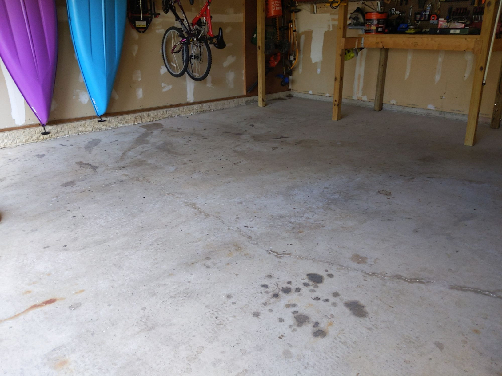 Stained, bare garage concrete