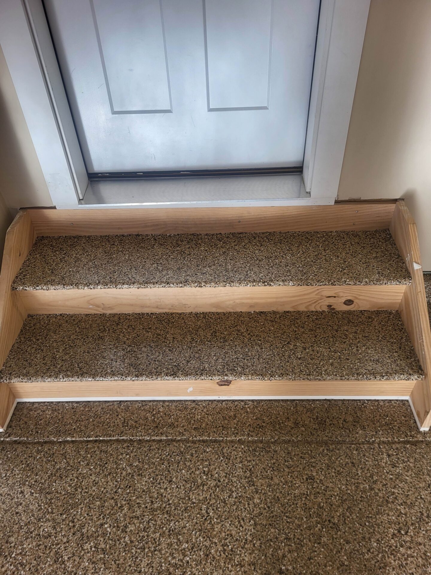 Coated wood stairs in garage