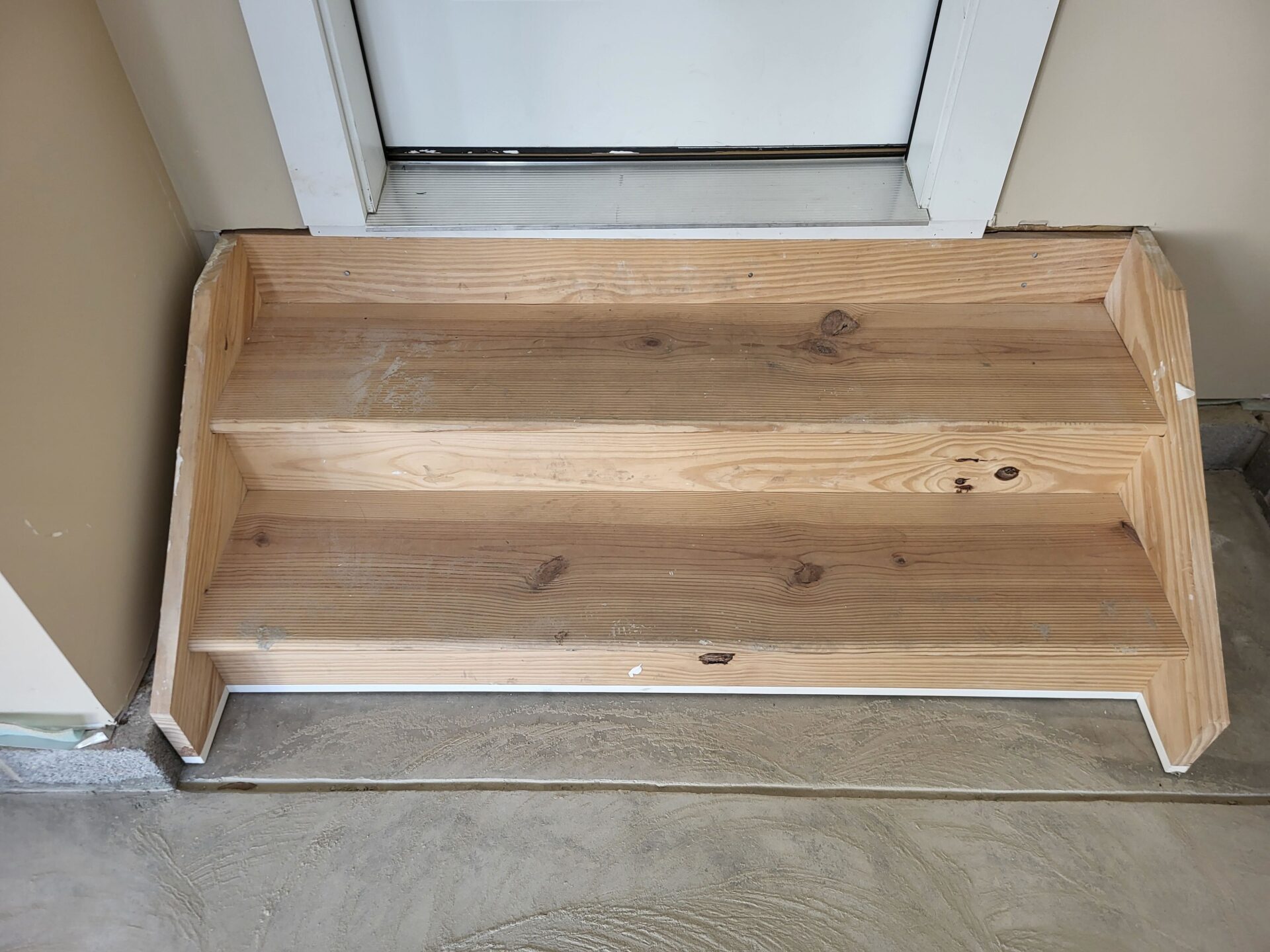 Uncoated wood stairs in garage