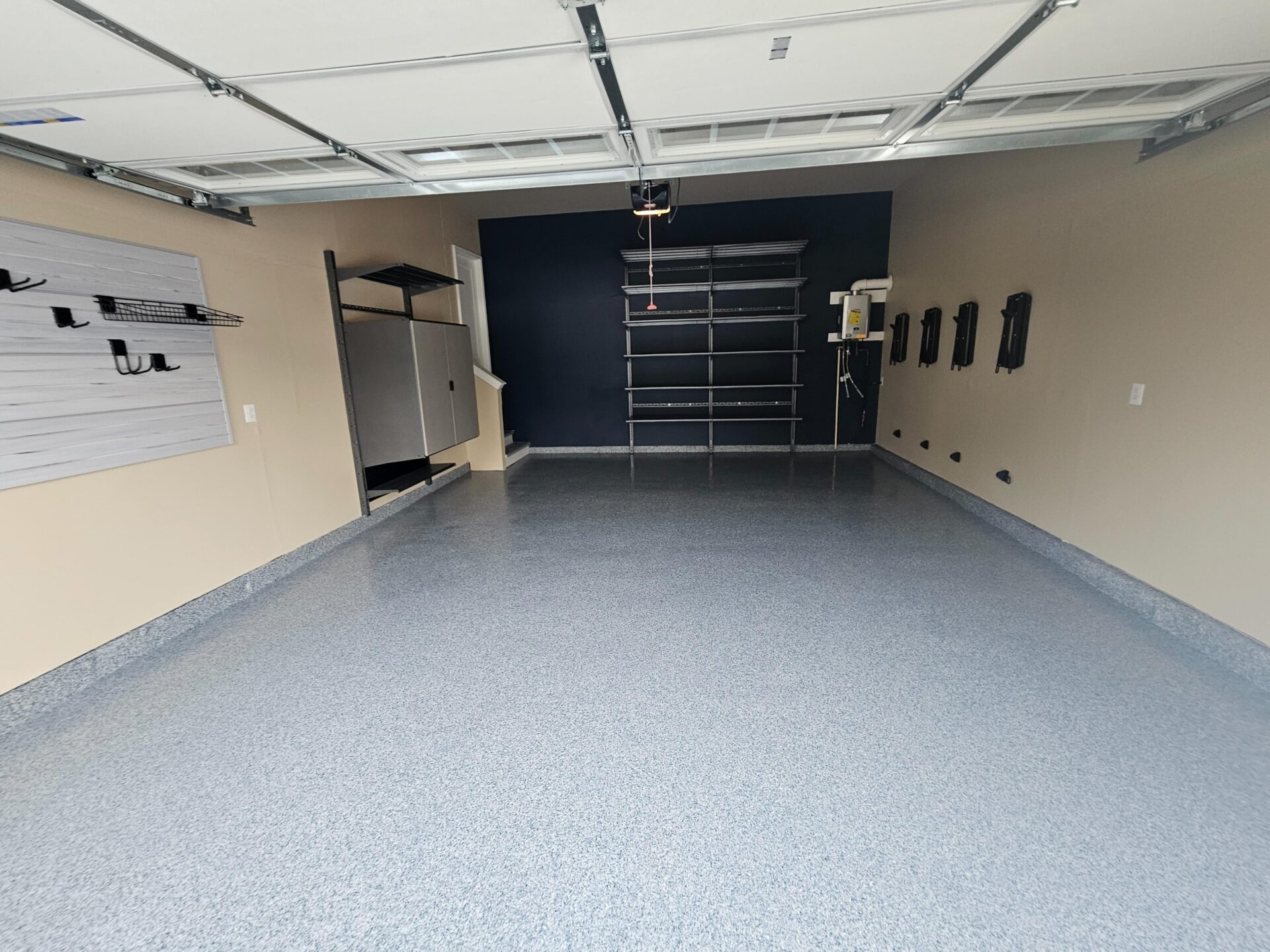 Garage with updated polyaspartic and garage storage