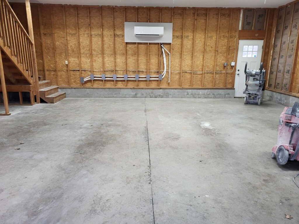 Empty Garage with stained concrete from tiremarks