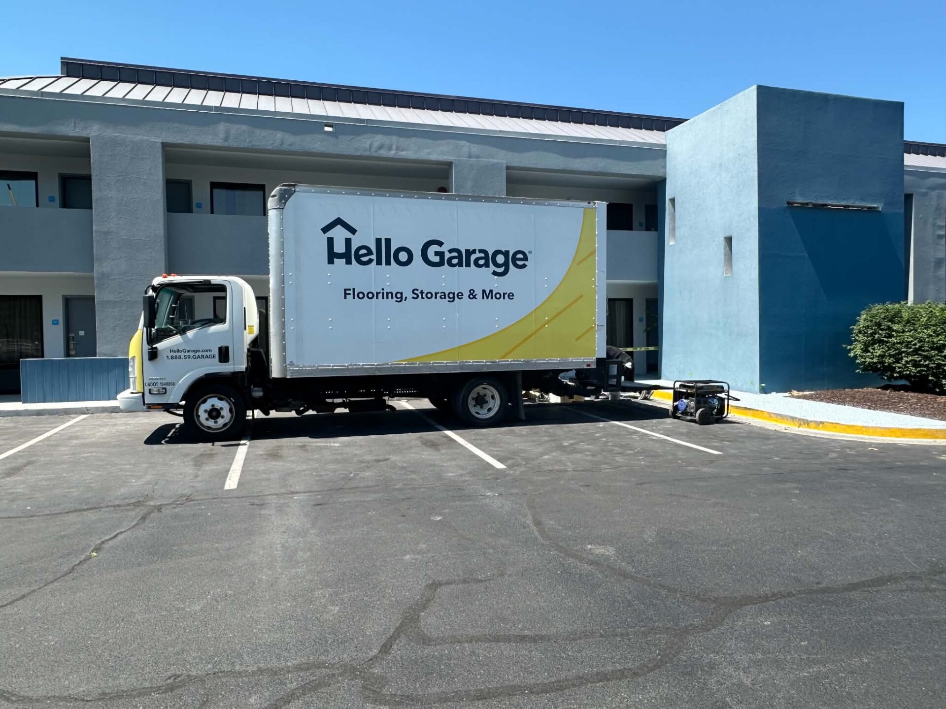 Hello Garage truck in front of best western hotel