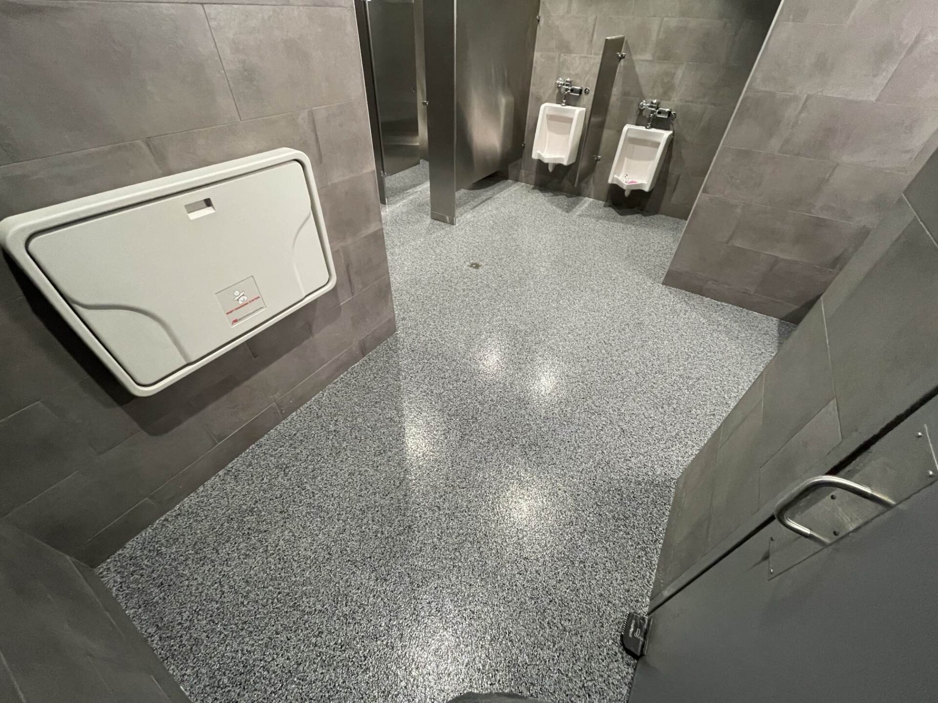 Polyaspartic concrete coating in business restroom