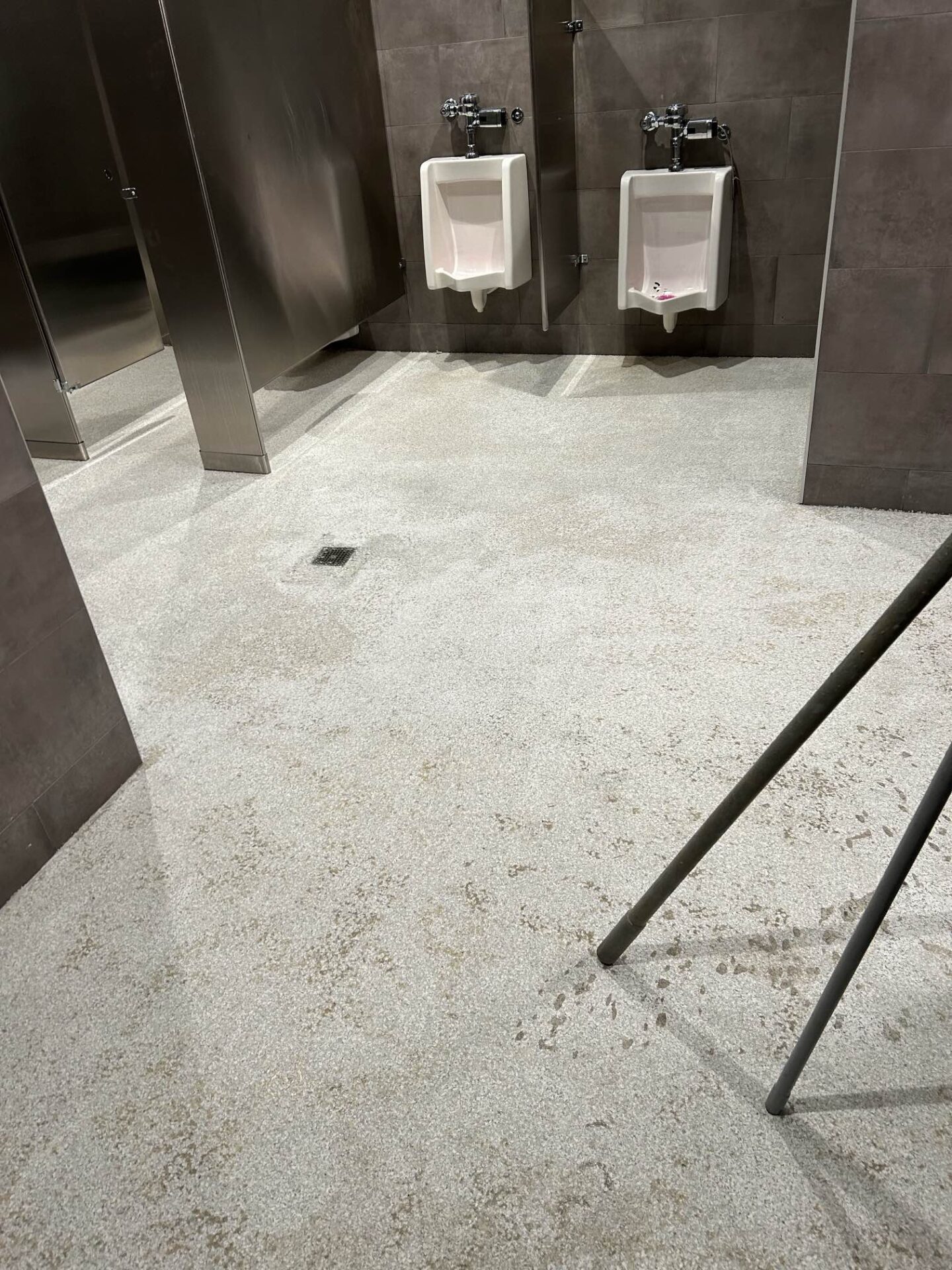 Bare concrete in business restroom