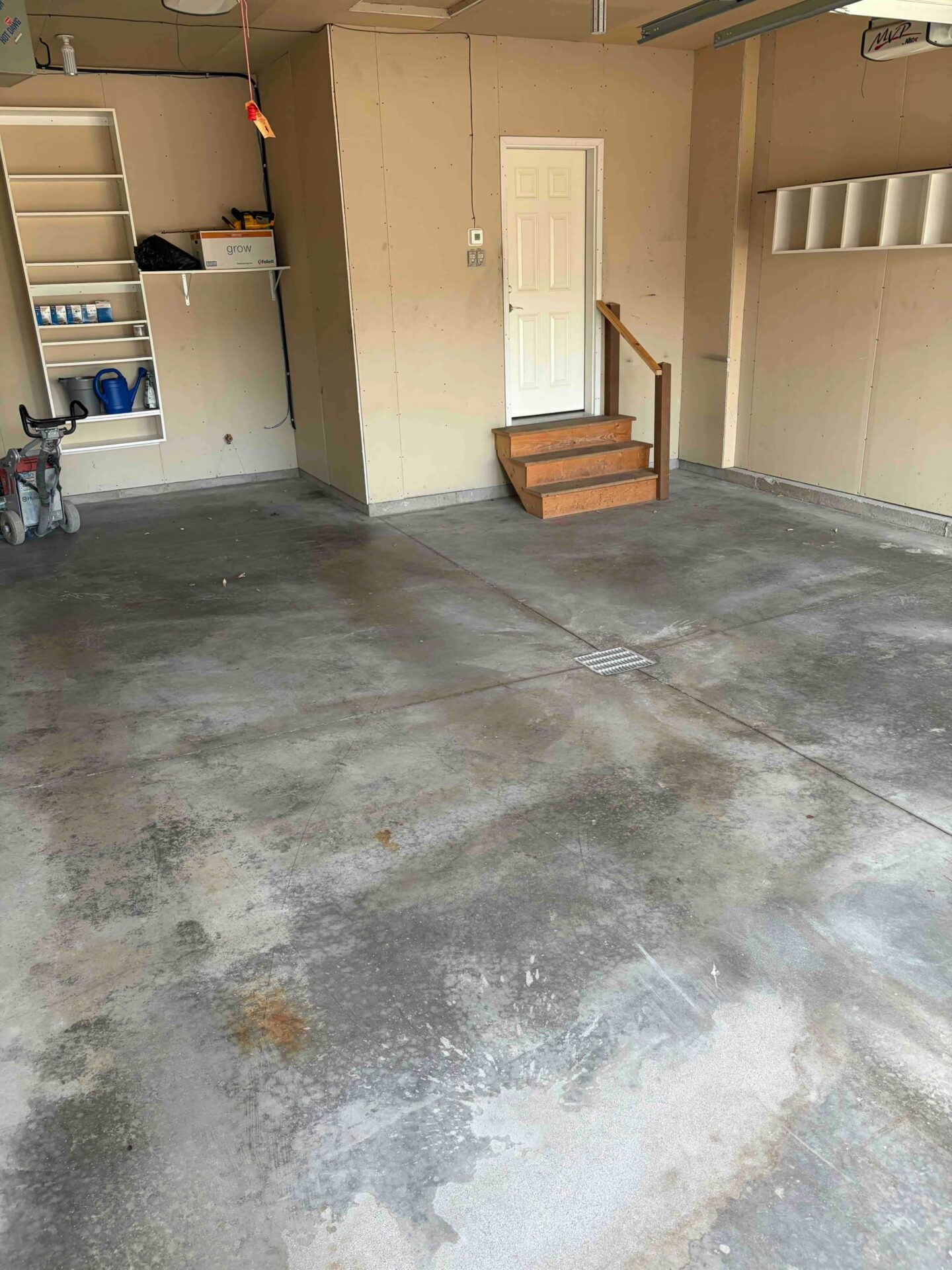 Damaged Concrete before a garage floor coating in West Fargo
