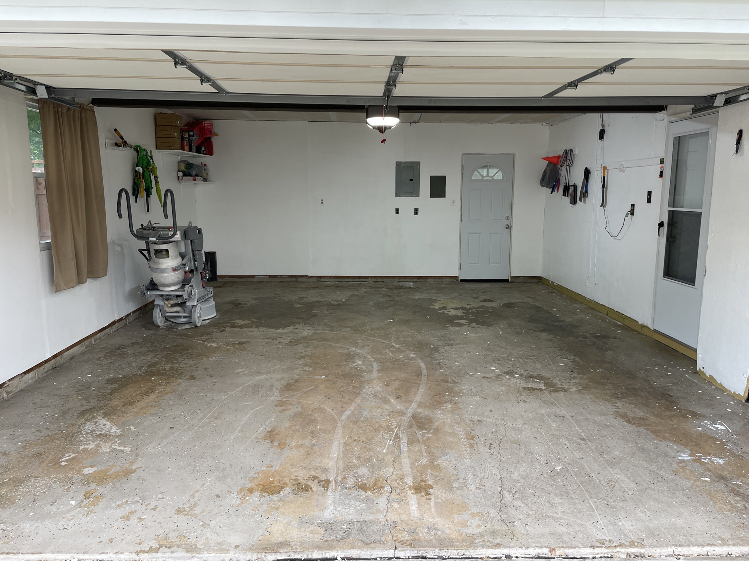 Cracked, stained garage concrete