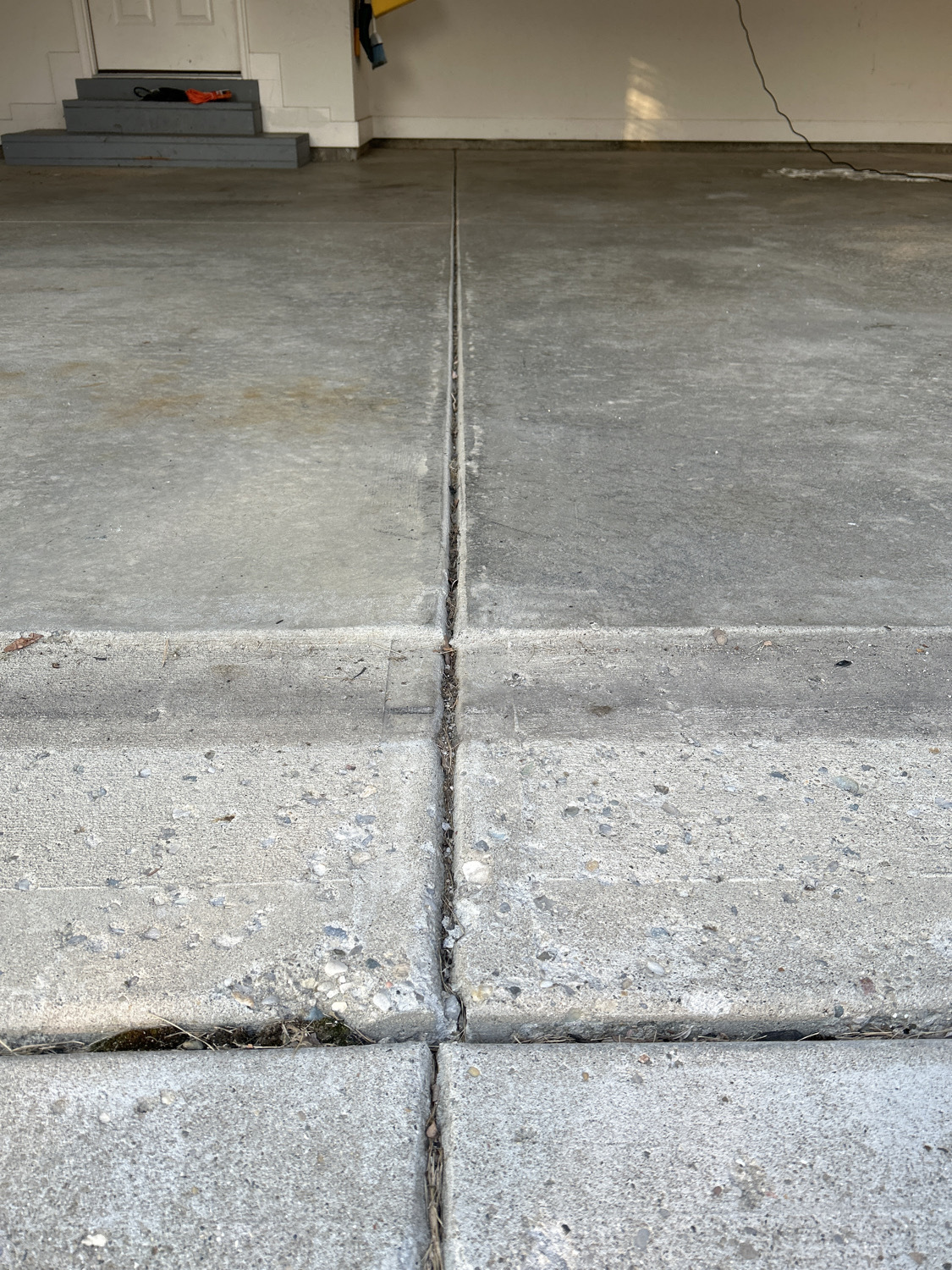 cracked, pitted garage concrete