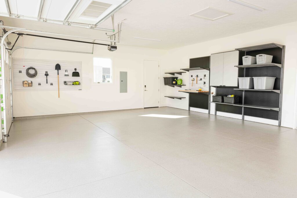 Organized garage with tan garage floor coating and wall storage