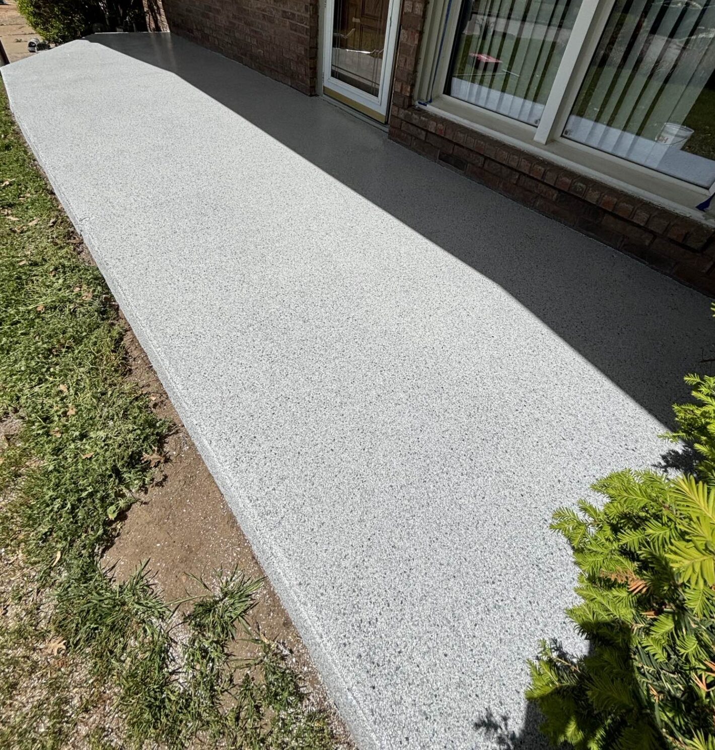 Polyaspartic coated concrete patio