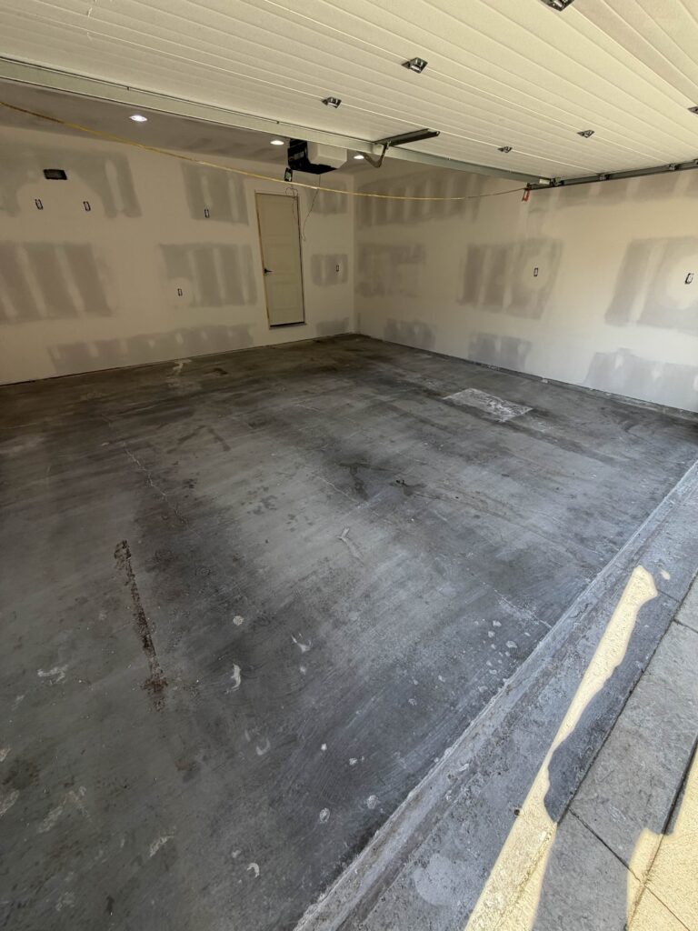 dirty stained garage before epoxy coating in Lee's Summit