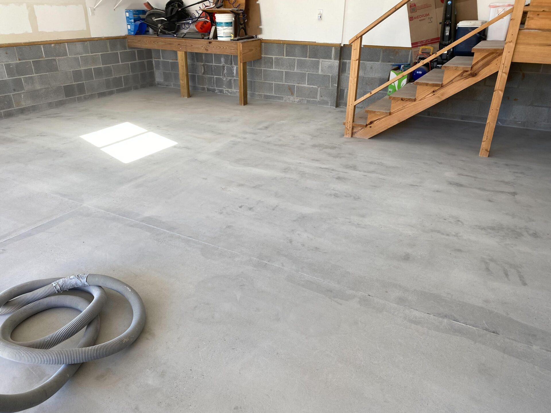 Uncoated concrete garage floor