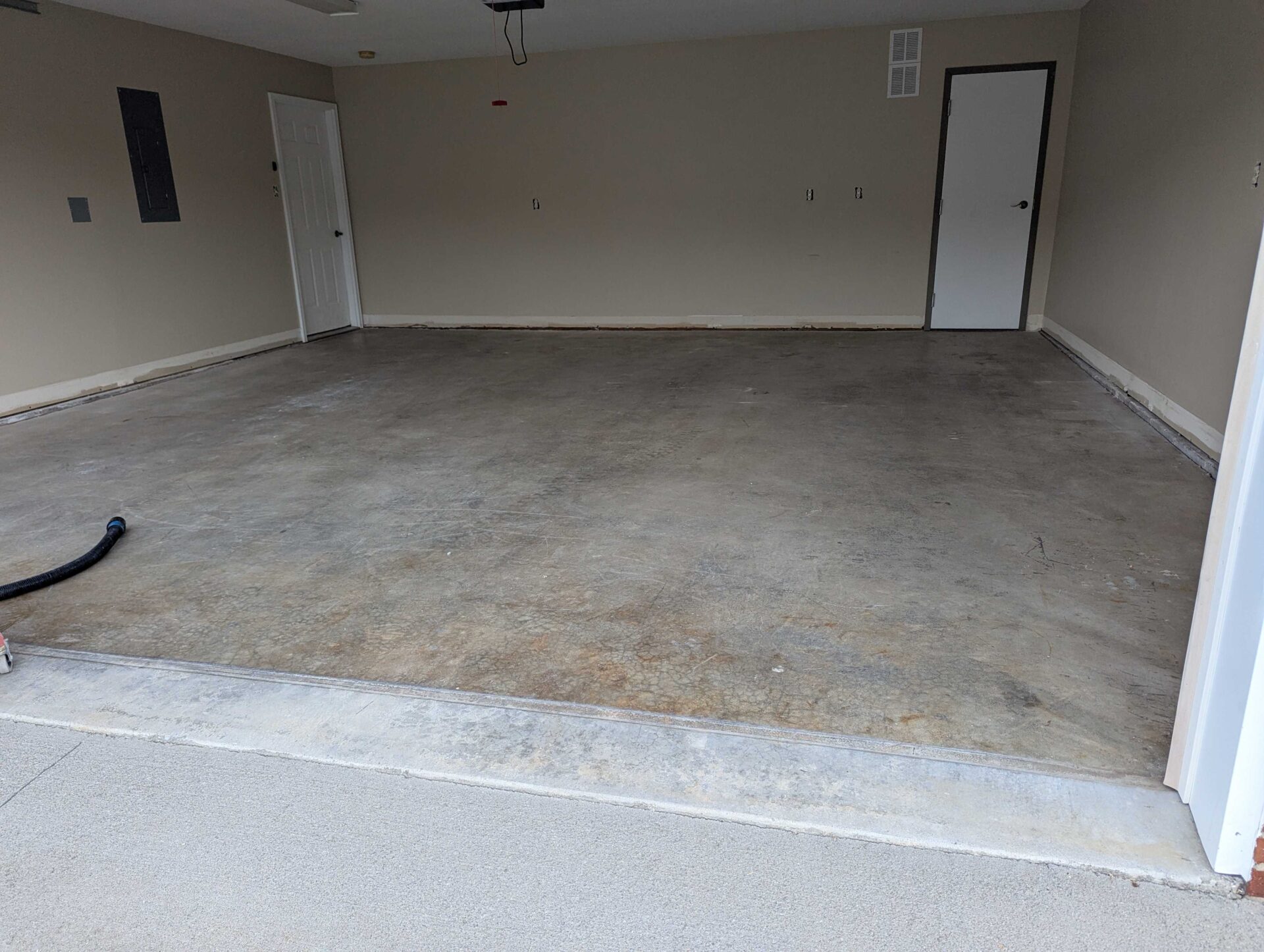 Dingy, stained garage concrete