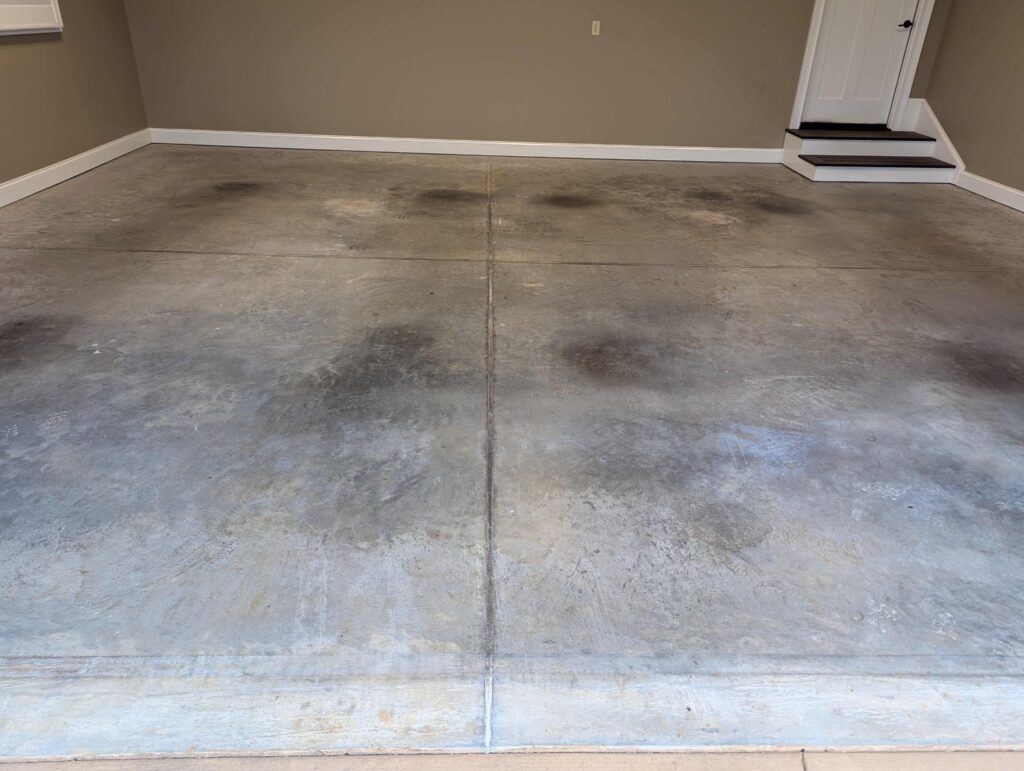 Bare garage floor before an epoxy coating