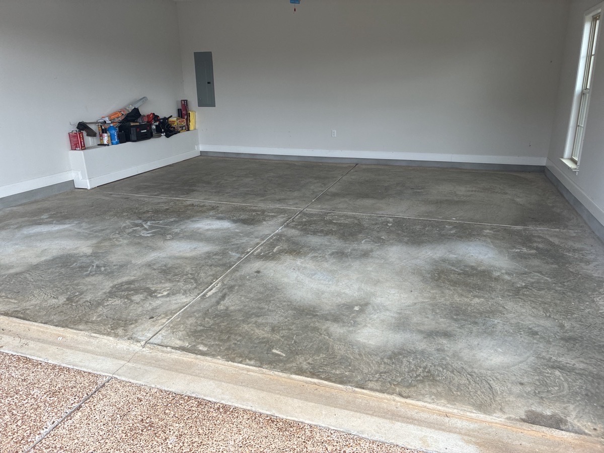 Stained Dirty Garage Floor Needing Remodel