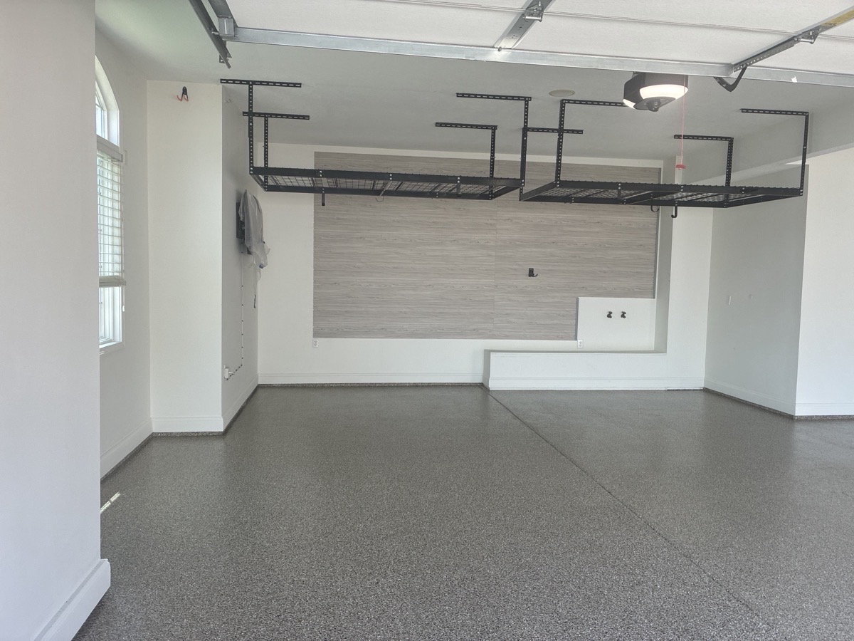 Taupe garage floor coating and overhead storage