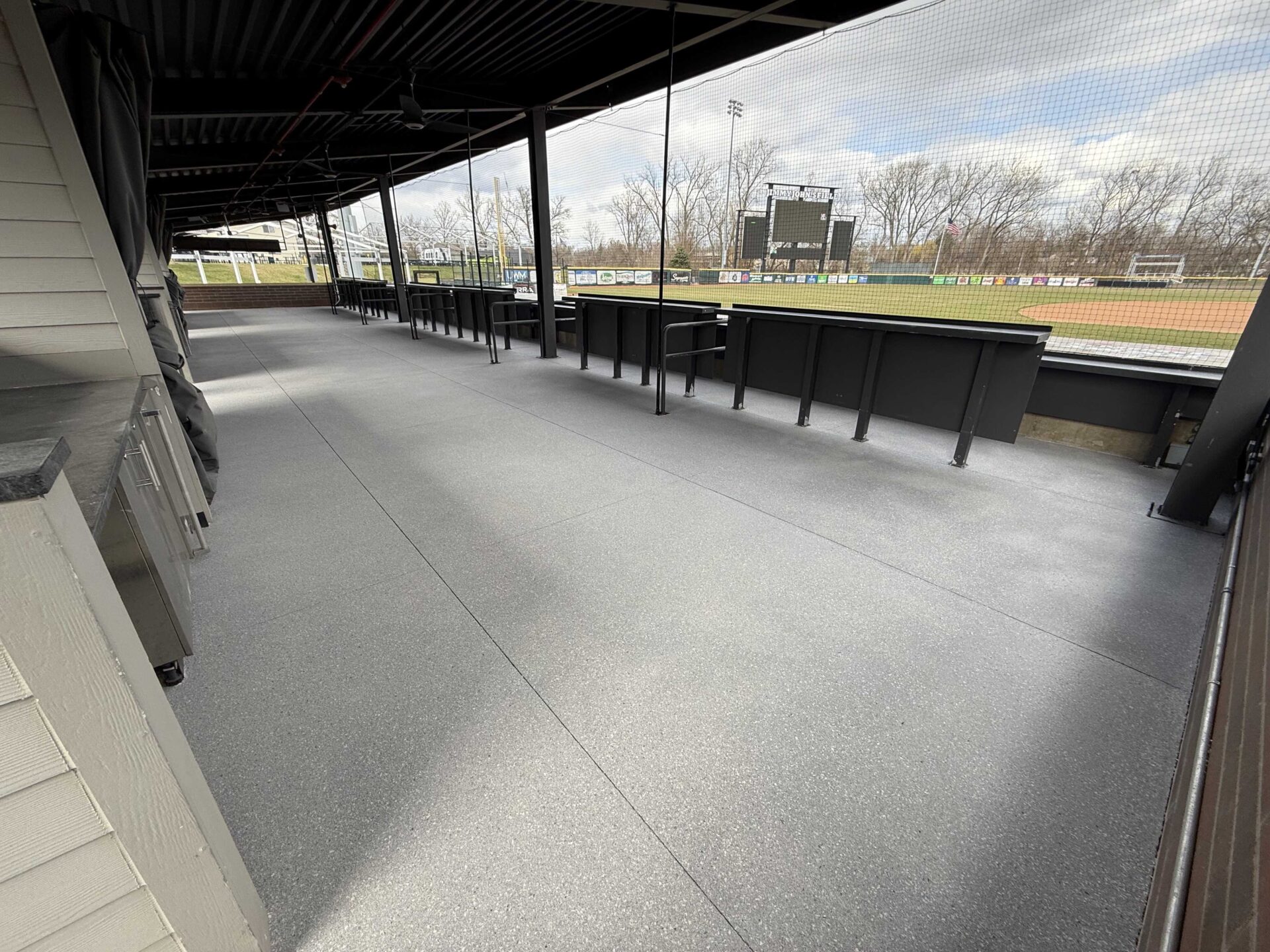 New polyaspartic floor coating at baseball field suite
