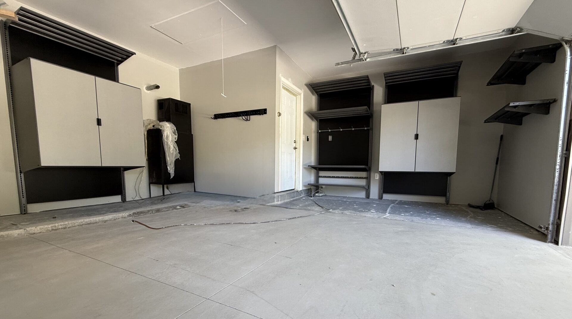 Garage with cabinets and shelving