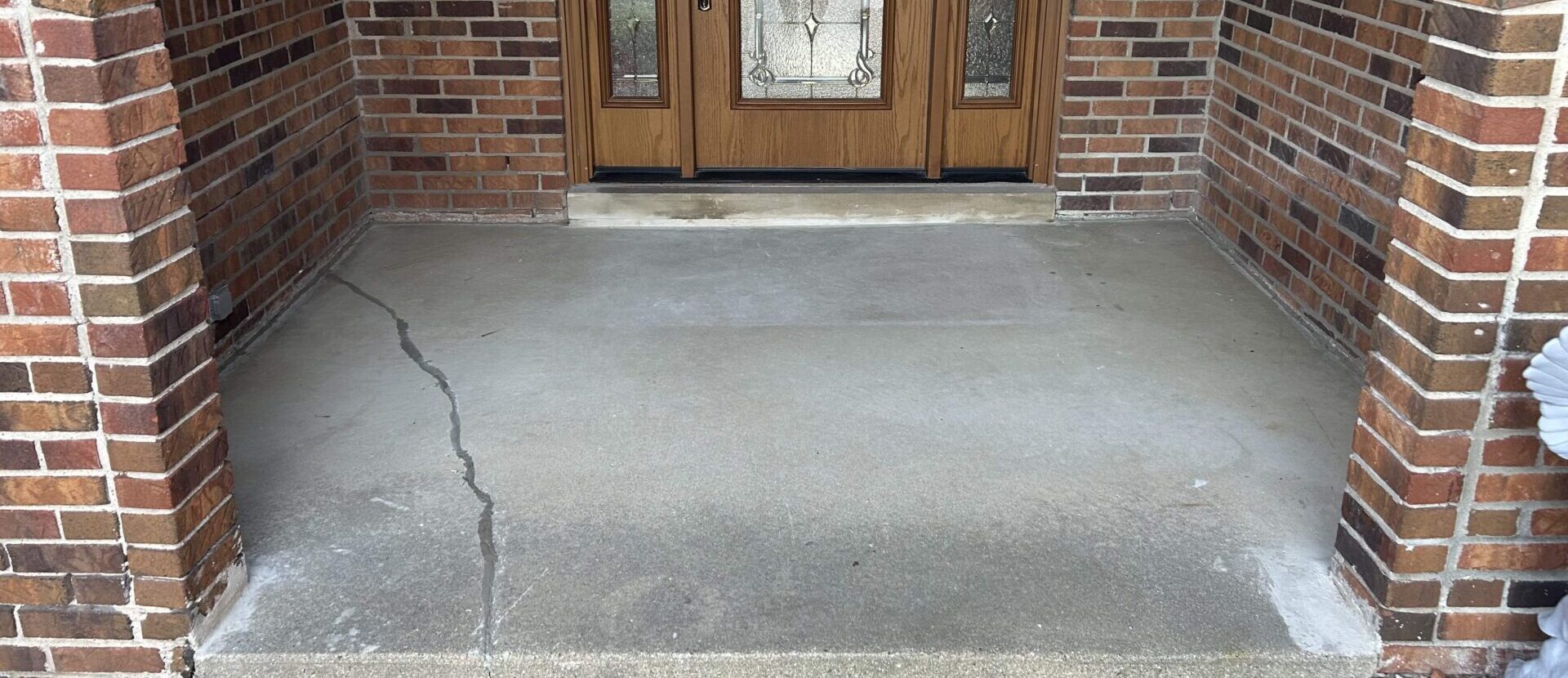 Cracked front stoop concrete