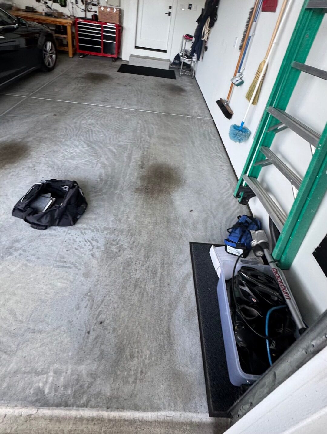 stained, uncoated garage concrete