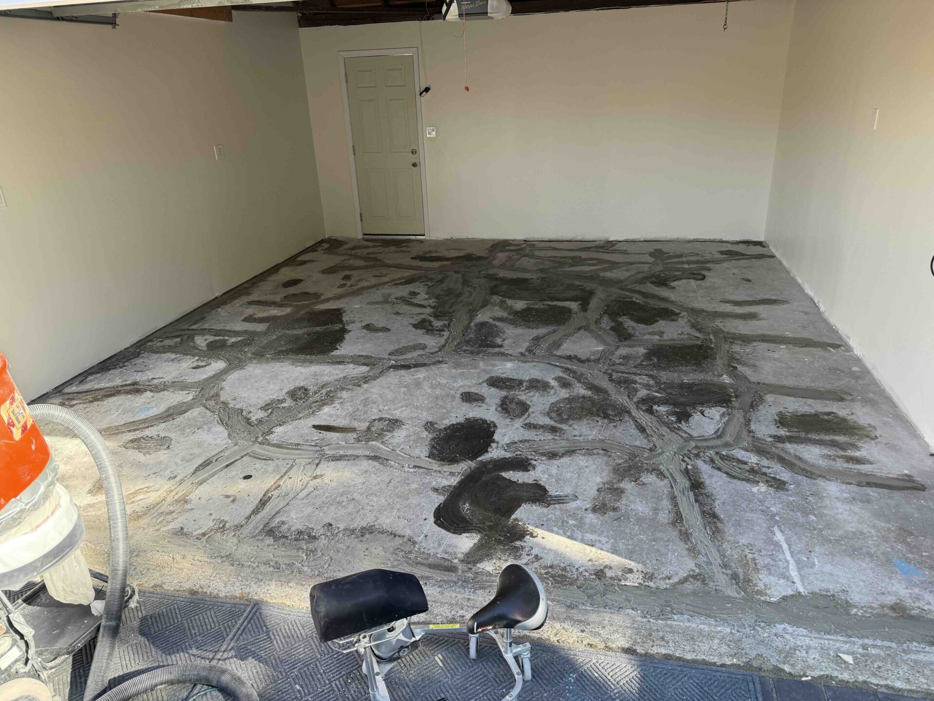 stained, uncoated garage floor