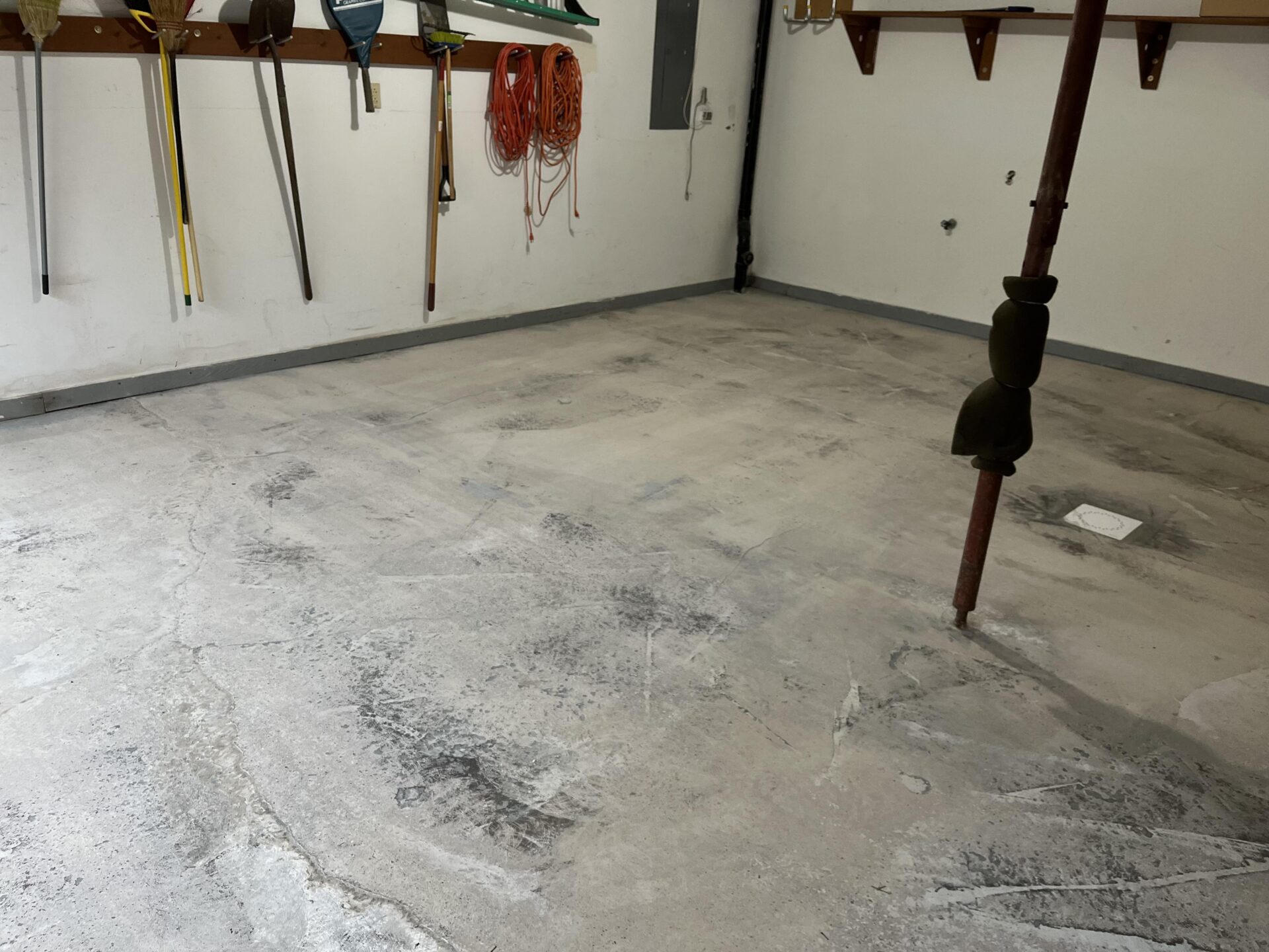 pitted, stained concrete in a garage