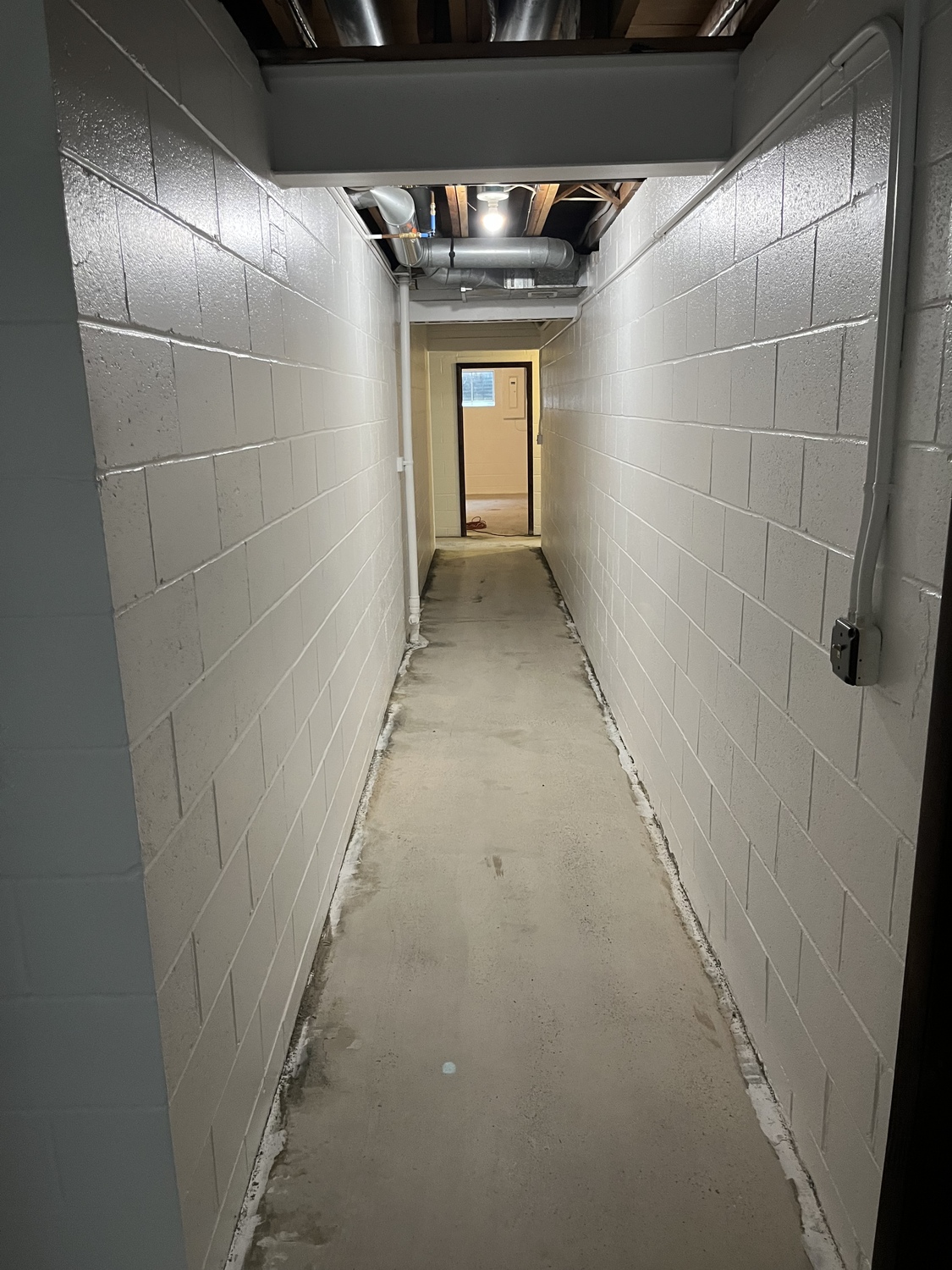 Commercial Concrete Hallway that has bare concrete and is about to get a concrete Coating