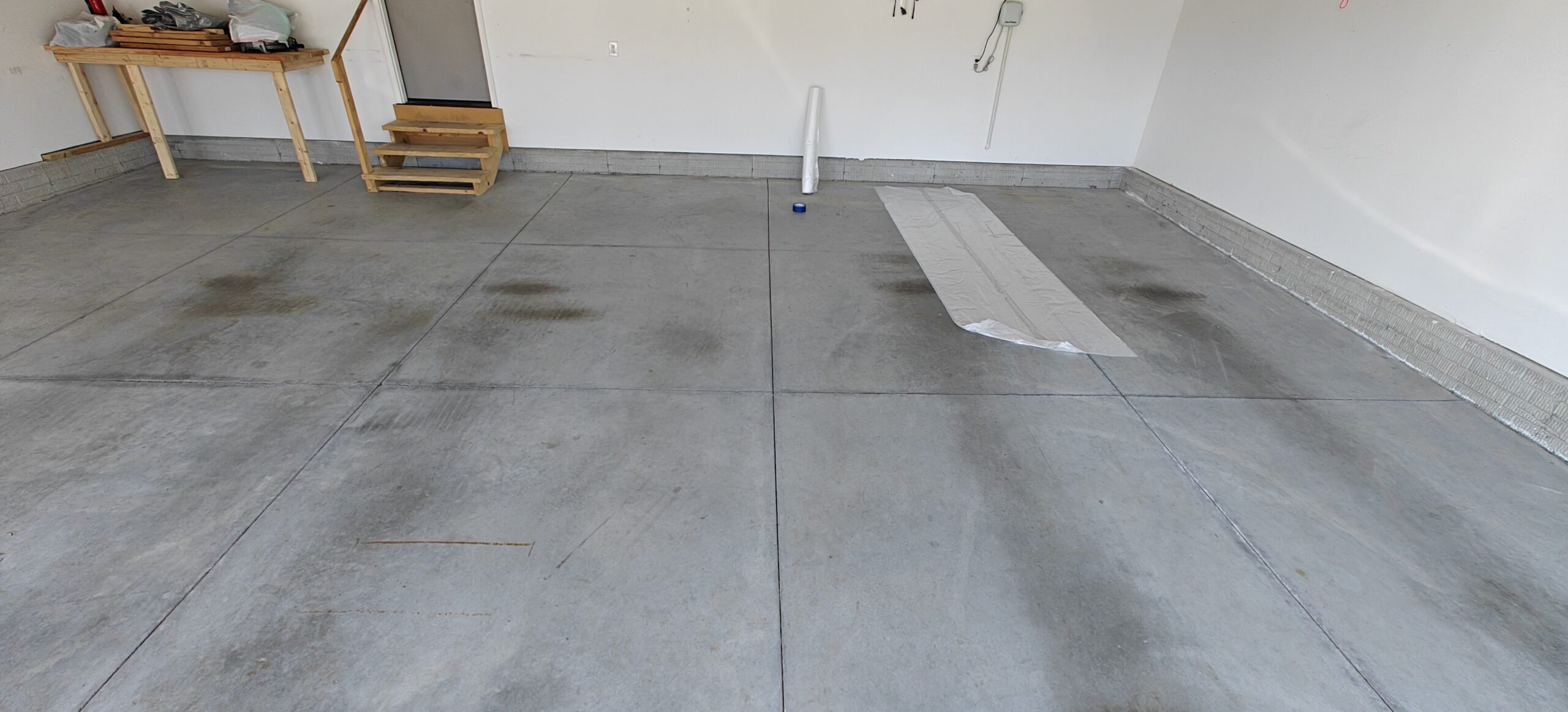 Stained, bland garage concrete