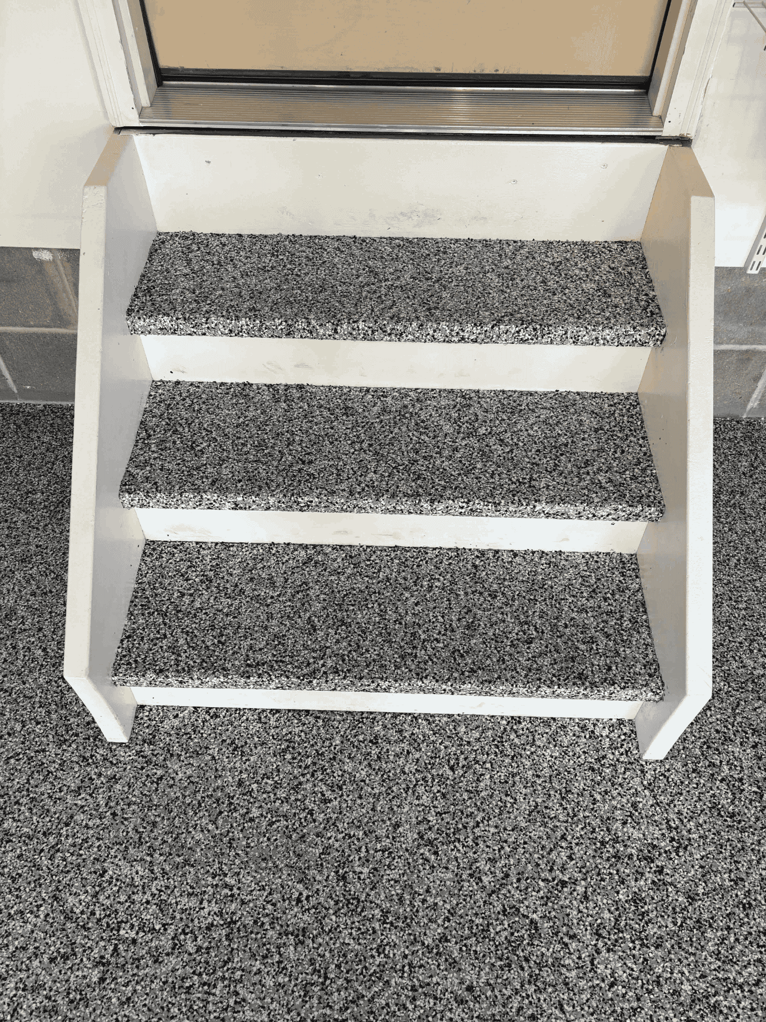polyaspartic coated stairs in garage