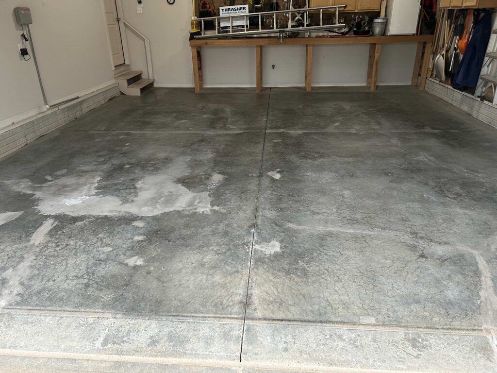 Cracked Garage Floor Before A Coating in Omaha, NE