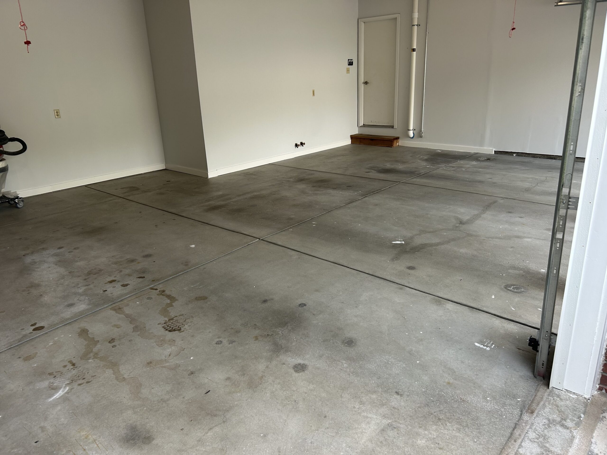 Dirty, worn Lincoln garage floor