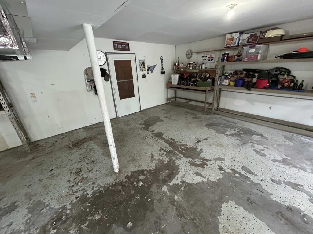 Old peeling epoxy floor before in South Bend