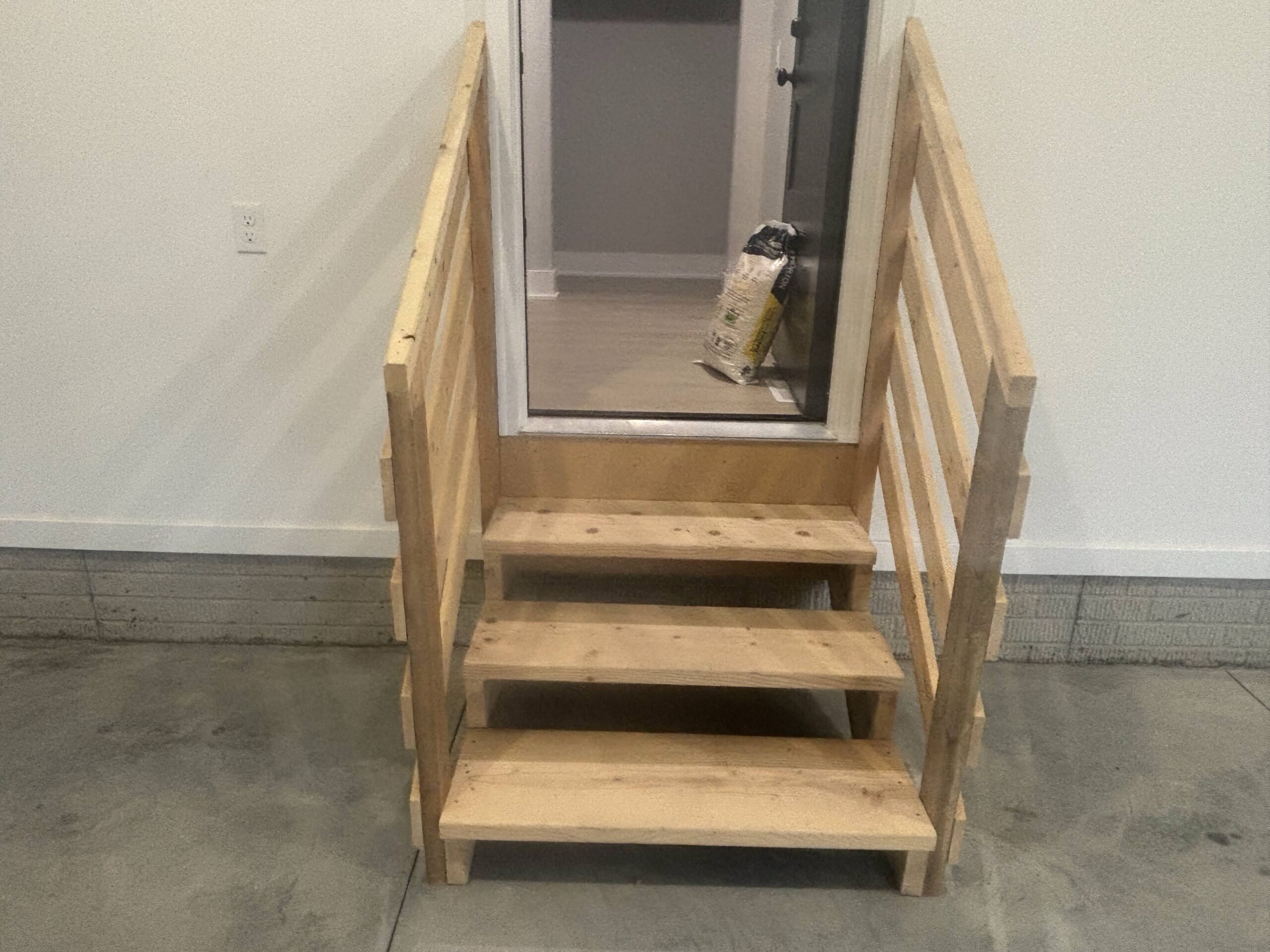 uncoated wooden stairs in garage