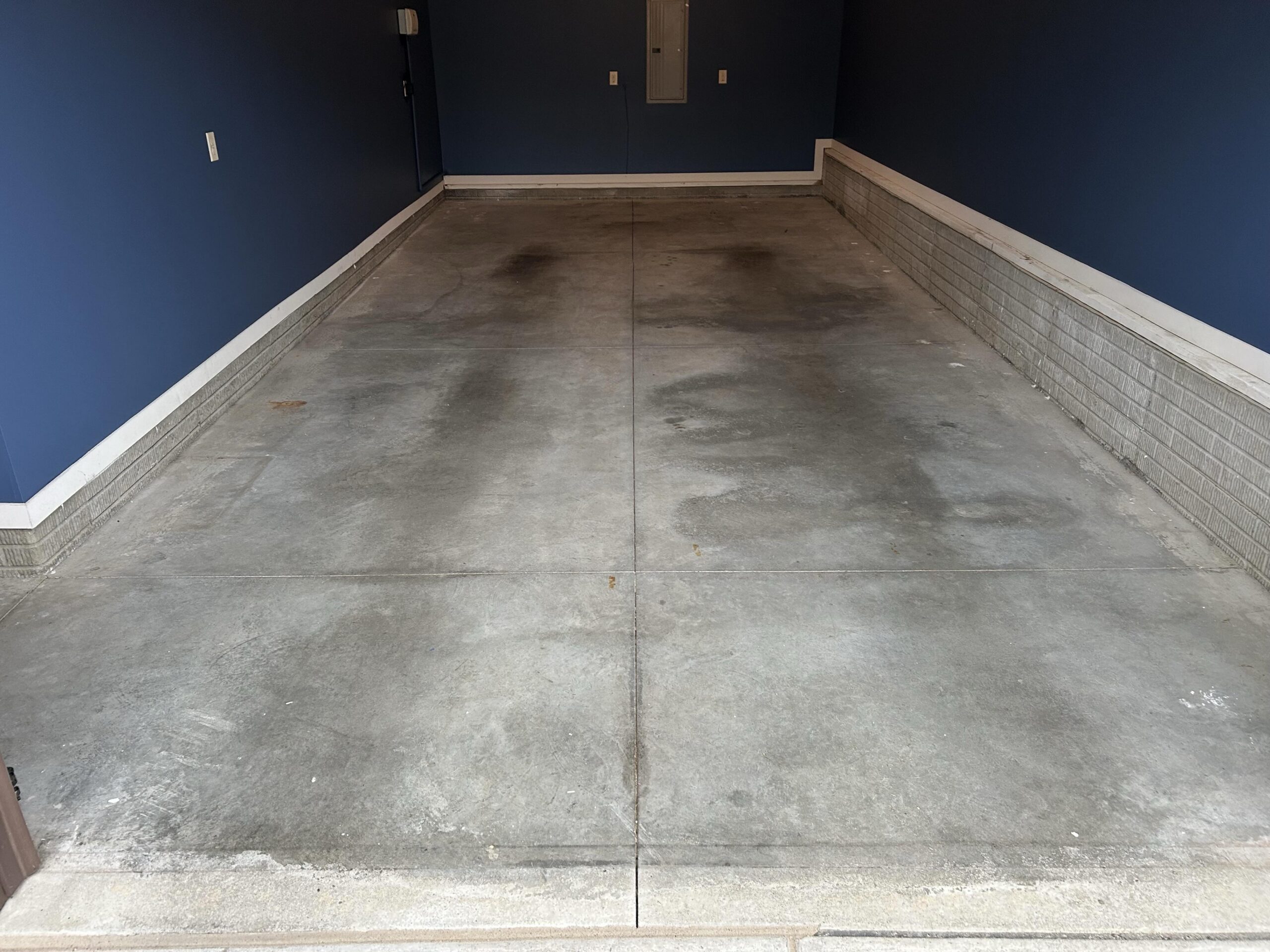 stained, worn concrete floor