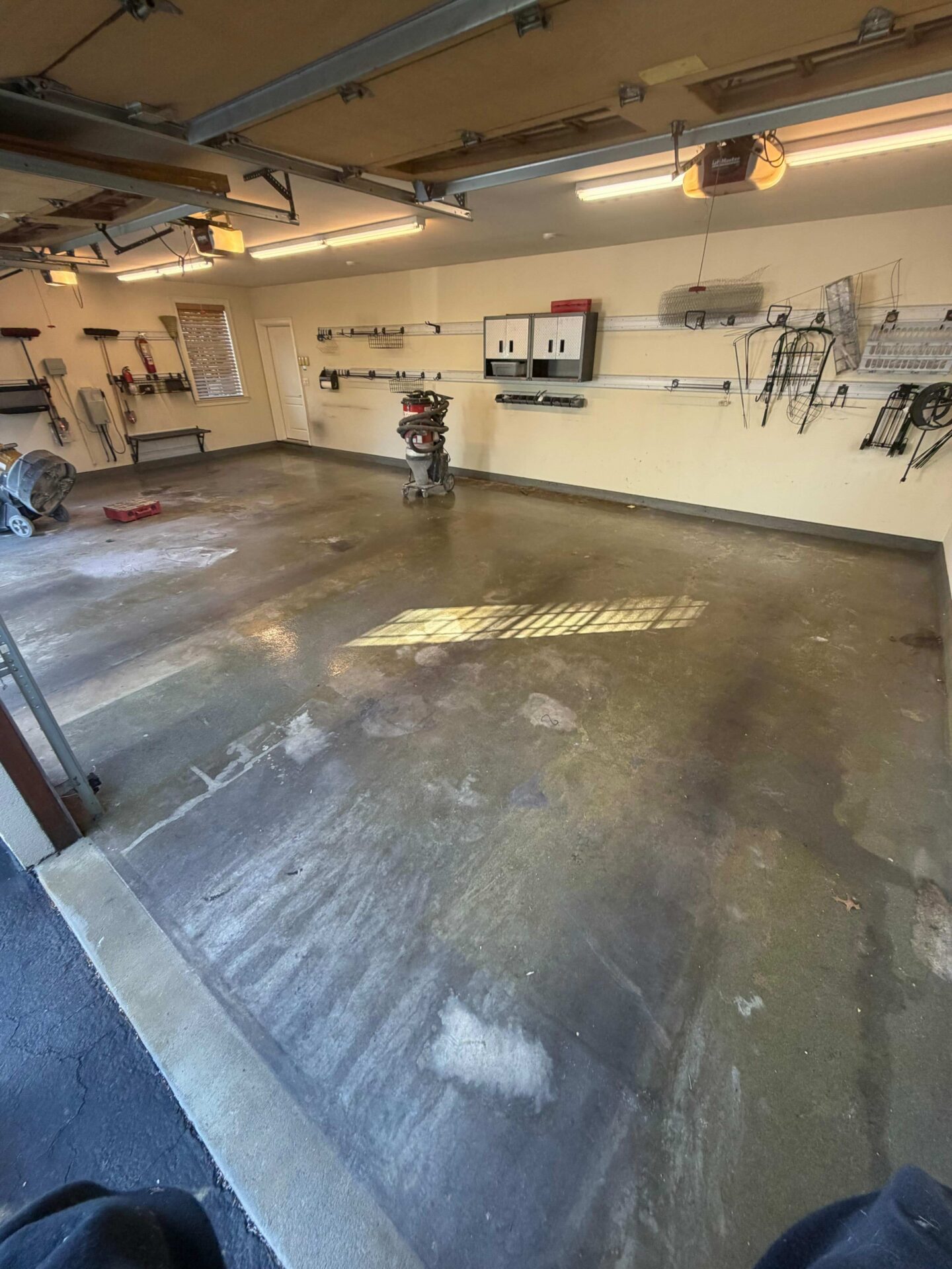 Stained Garage Floor in an empty garage ready for garage flooring and storage