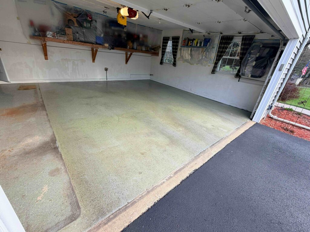 Stained Garage Floor in Downington before a garage floor coating is installed