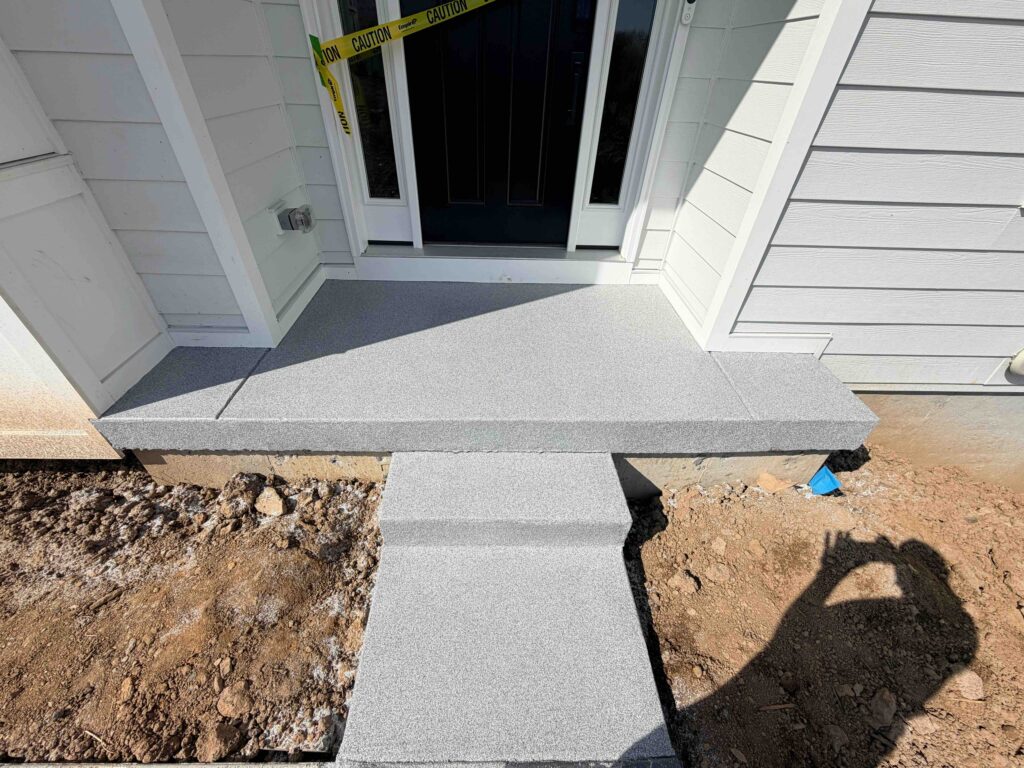 Front Porch after a concrete coating in the color carbon done by Hello Garage