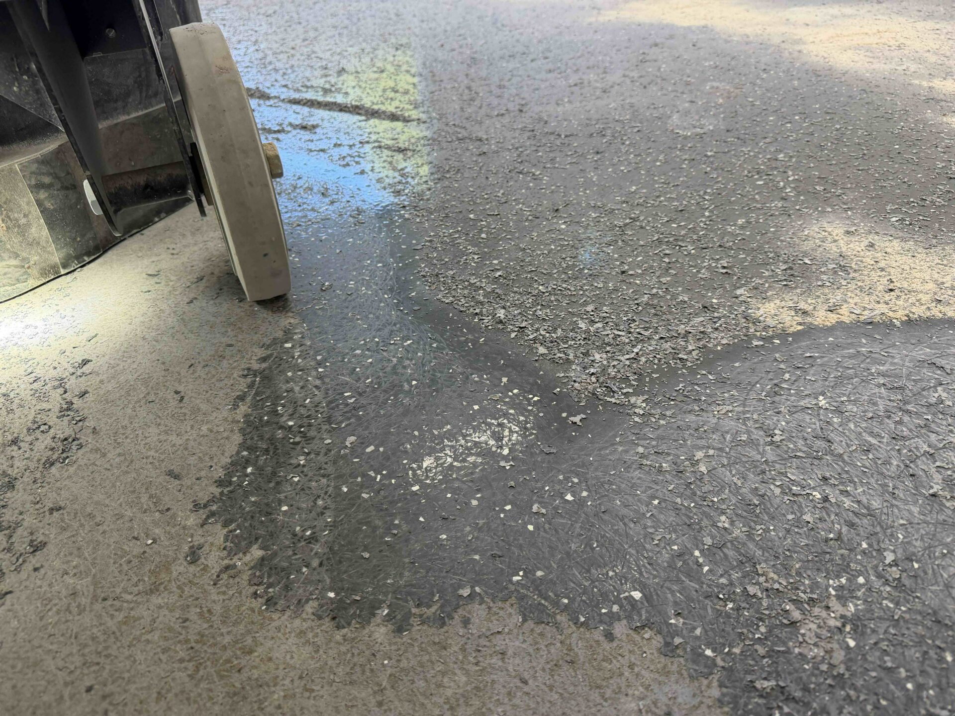 pitted and worn garage concrete