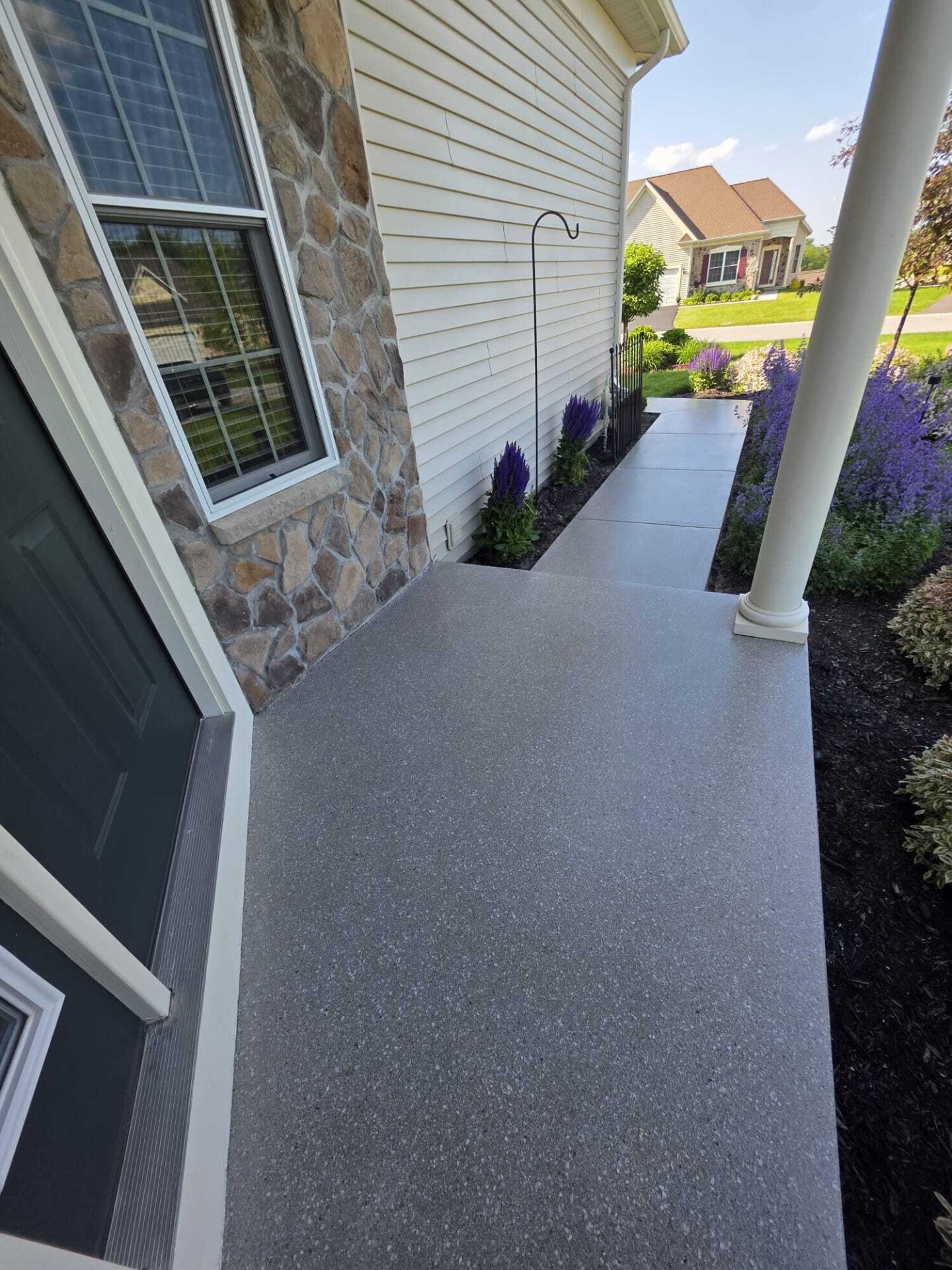 Polyaspartic coated front porch and walkway