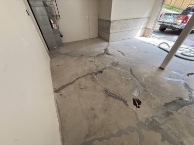 cracked garage floor before photo in Lake Forest Park WA
