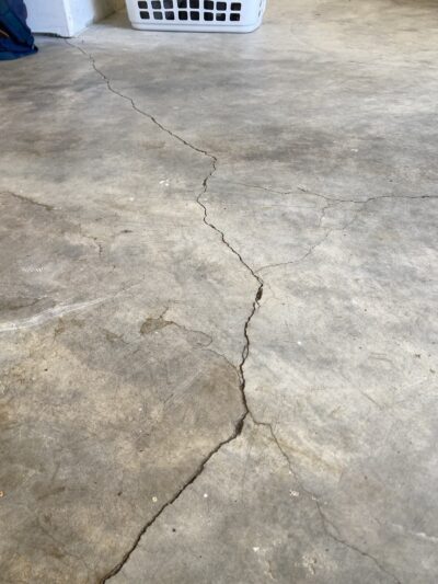 cracked garage floor before concrete coating in Seattle