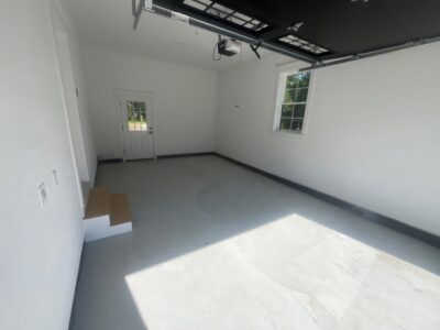 one car garage floor coating before photo in Falmouth
