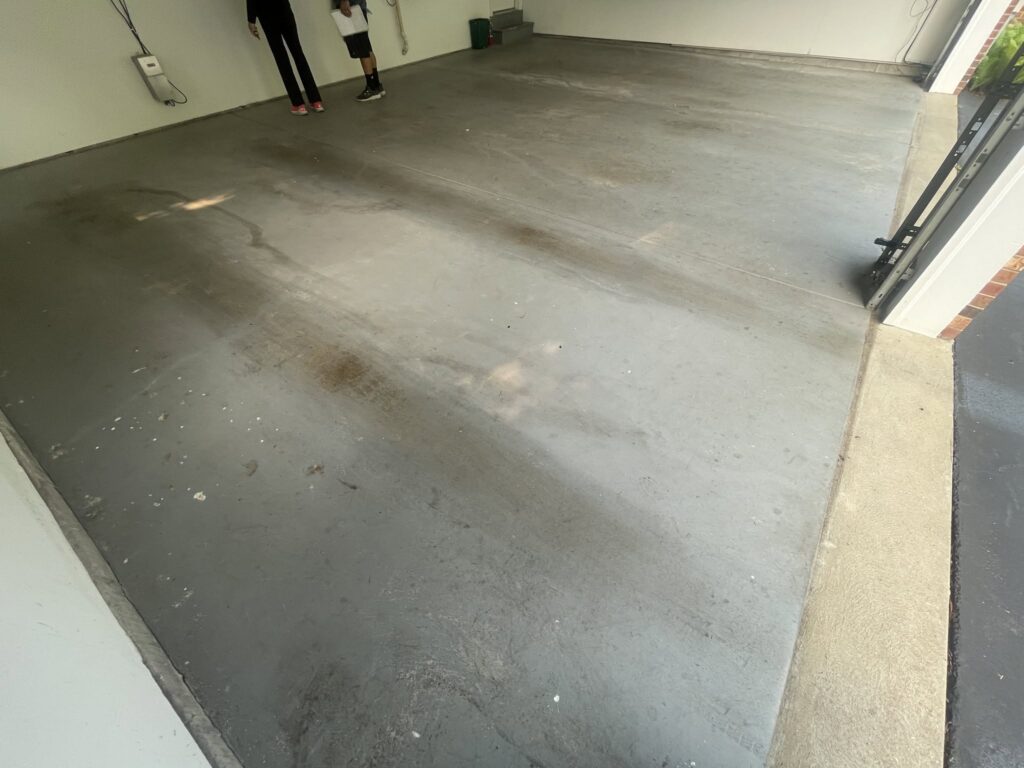 Stained garage floor before in Chesterfield