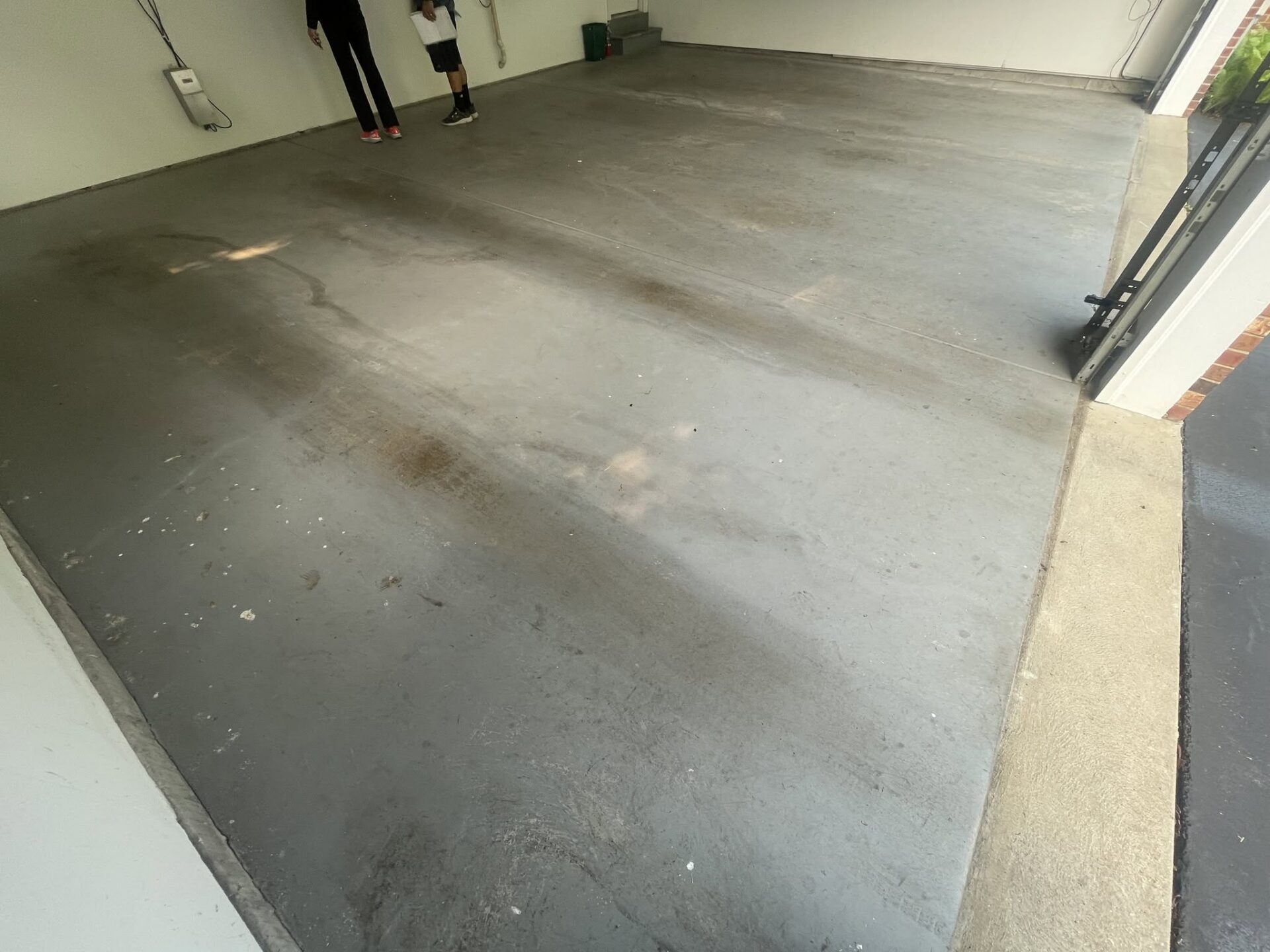 Stained garage floor before in Chesterfield