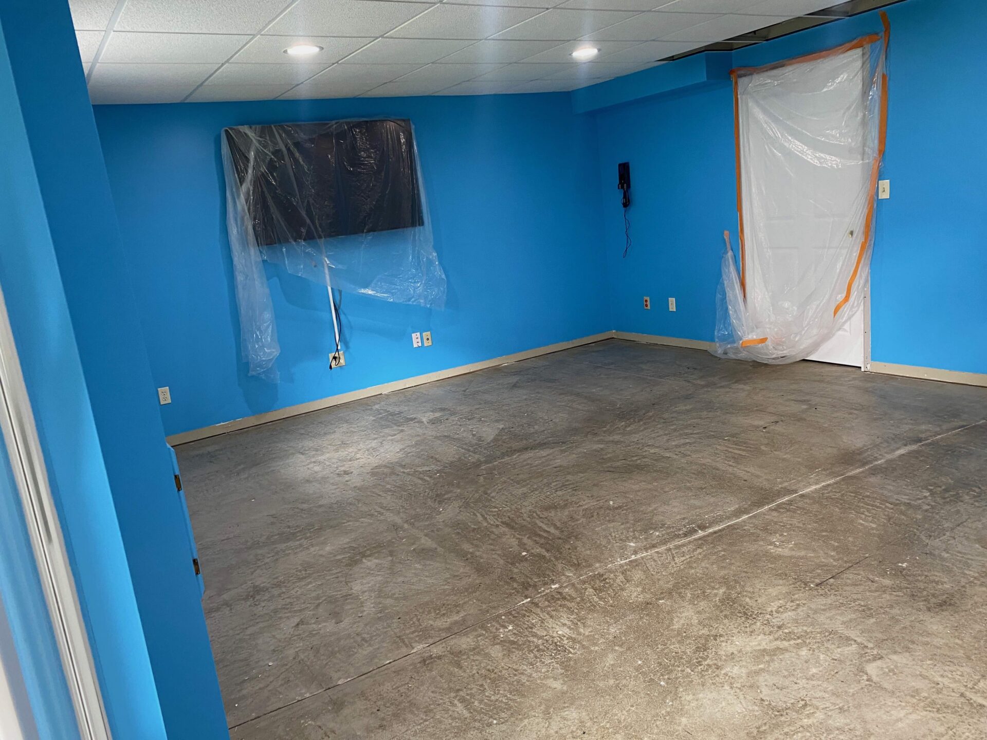 Basement floor coating before in Ballwin