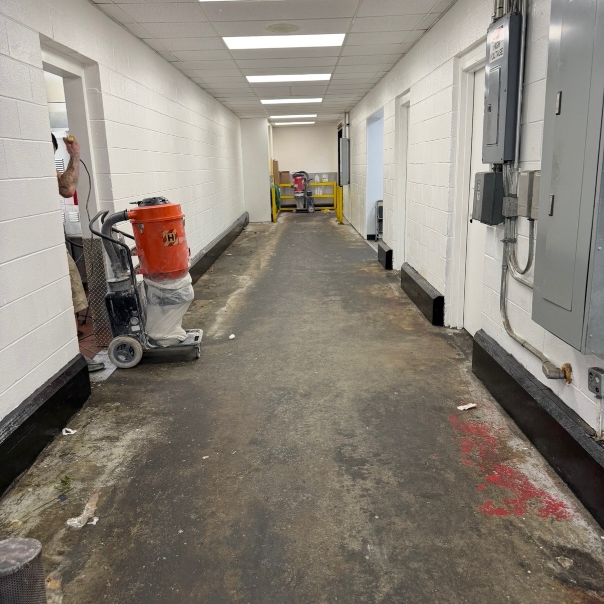 Before commercial concrete coating job in Leland