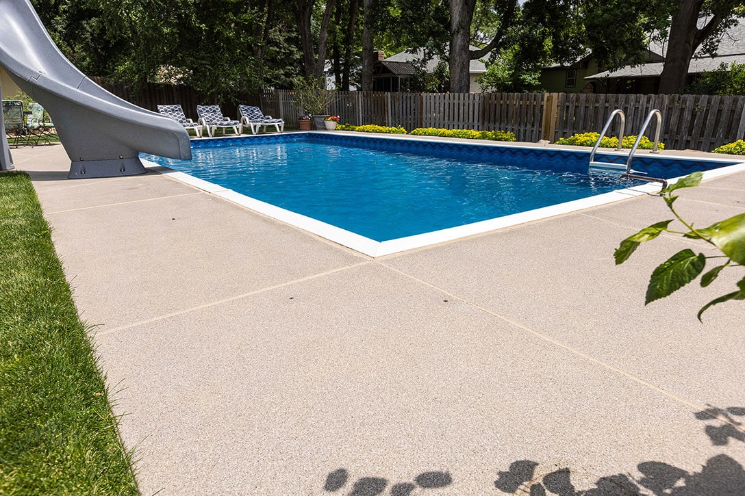new outdoor flooring next to a pool | Hello Garage